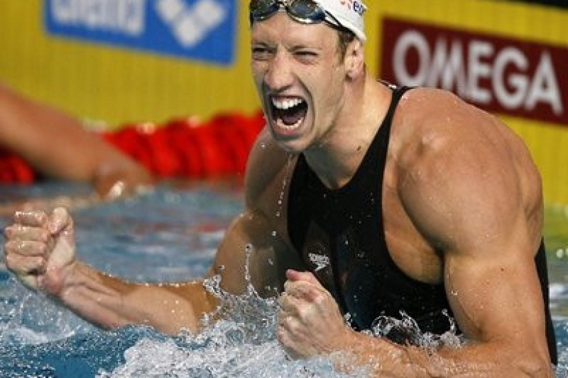 France's Alain Bernard celebrates as he realises he set a new world record for the men's 100 metres freestyle in a time of 47.60sec in the semifinals of the 29th LEN European Swimming Championships, on March 21, 2008 in Eindhoven.  AFP PHOTO / JOHN THYS