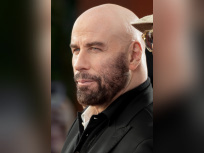 John Travolta, interprète de Jack Stanton dans Primary Colors