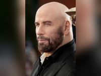 John Travolta, interprète de Jack Stanton dans Primary Colors