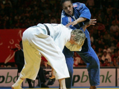 Lucie Decosse (R) of France vies with Urska Zolhir (L) of Slovenia in the women's 63 kg final final of the Euro Judo Championship in Belgrade, 07 April 2007.Decosse  won the final.        (Photo credit should read DIMITAR DILKOFF/AFP/Getty Images)
