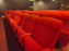 Visuels salles de spectacle et théâtres - salle de cinéma fauteuil rouge