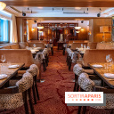 Doobie's : salle de restaurant aux banquettes et tables dressées