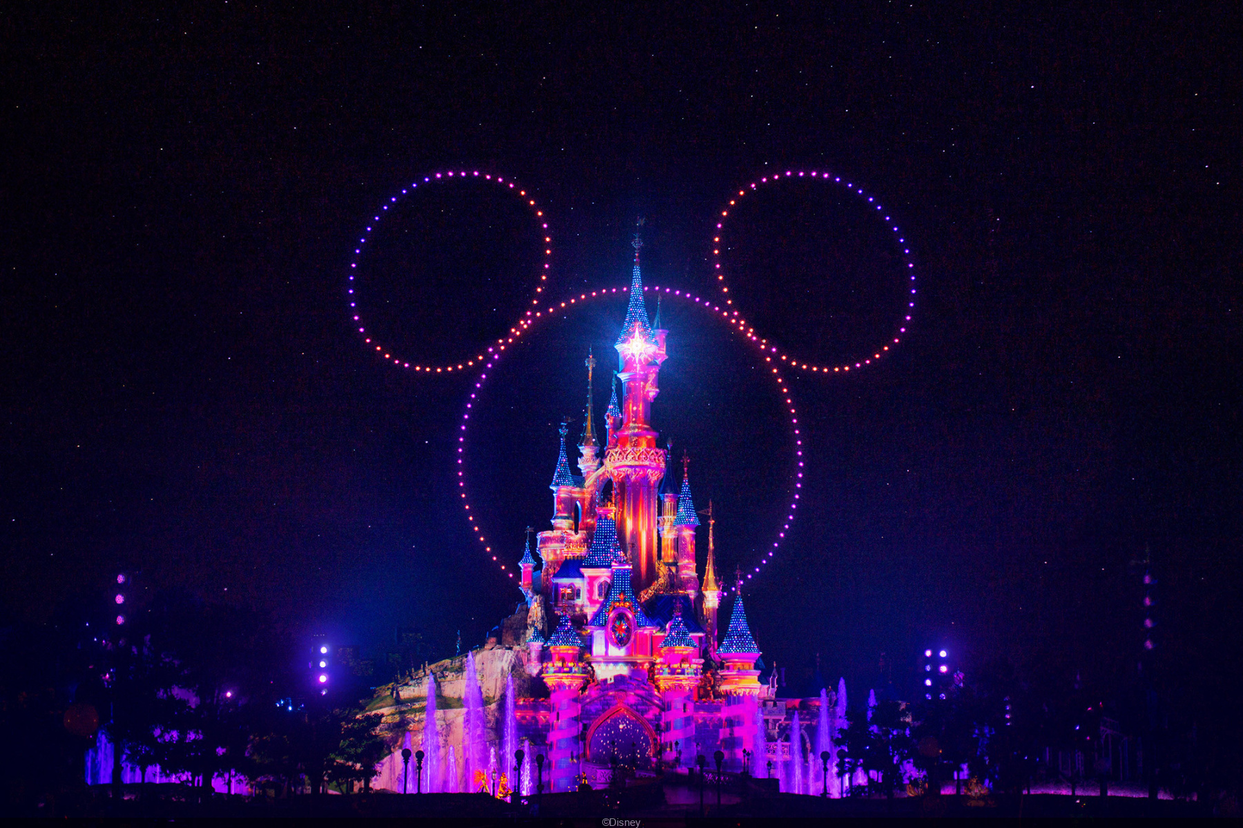 Disneyland Paris Lights Sleeping Beauty Castle in Green in Celebration of  St. Patrick's Day 