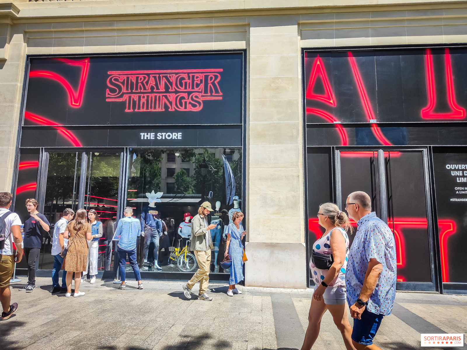 PARIS-APR 14: Customers are on queue to enter Louis Vuitton shop at Champ  Elysee avenue